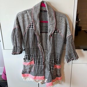 Black and white sweater with pink stitching